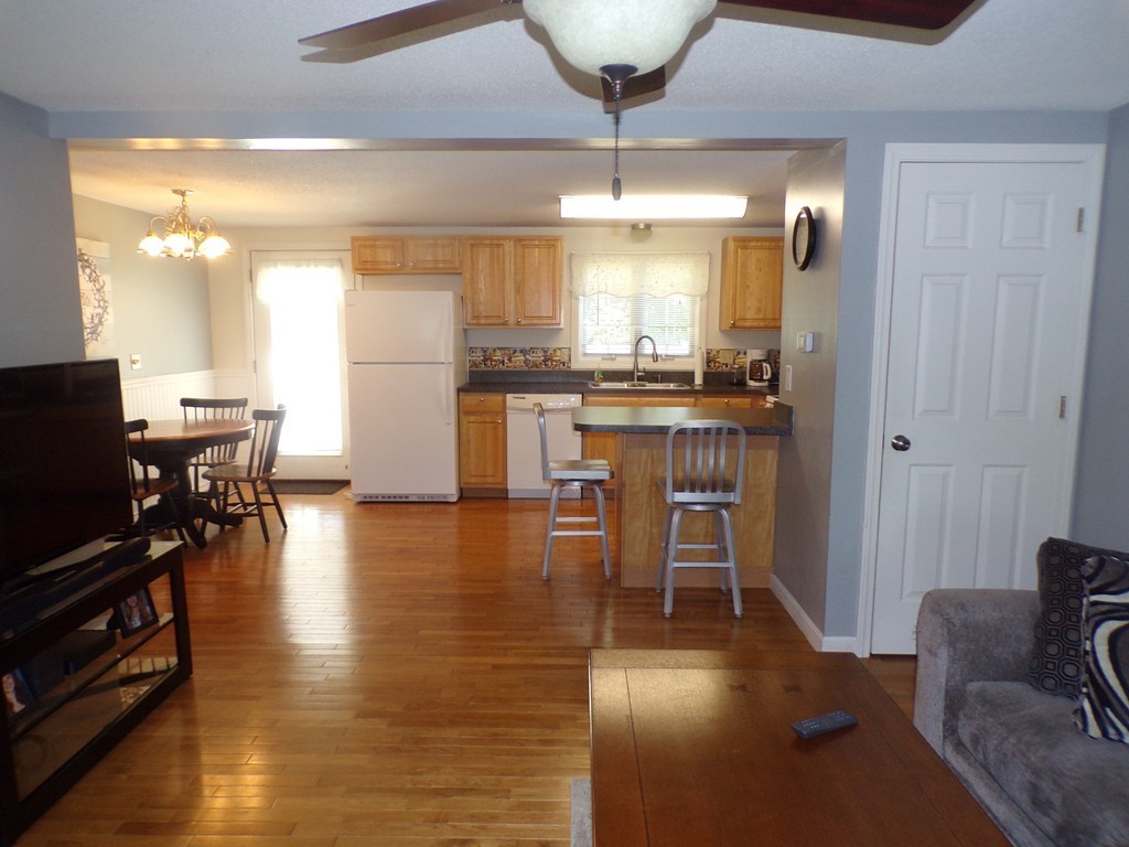 85 Belanger Street, Unit 85 Three Rivers, MA 01080 - Photo 5 of 16 a view of a dining room with furniture window and wooden floor