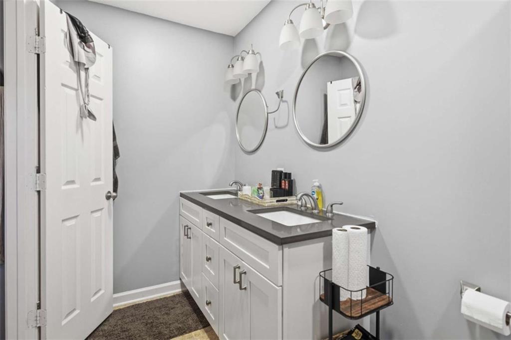 638 Providence Place Southwest Atlanta, GA 30331 - Photo 13 of 22 a bathroom with a sink and a mirror