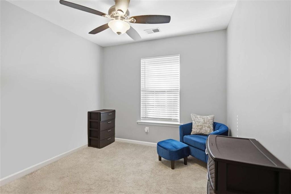 638 Providence Place Southwest Atlanta, GA 30331 - Photo 16 of 22 a bedroom with furniture and a window