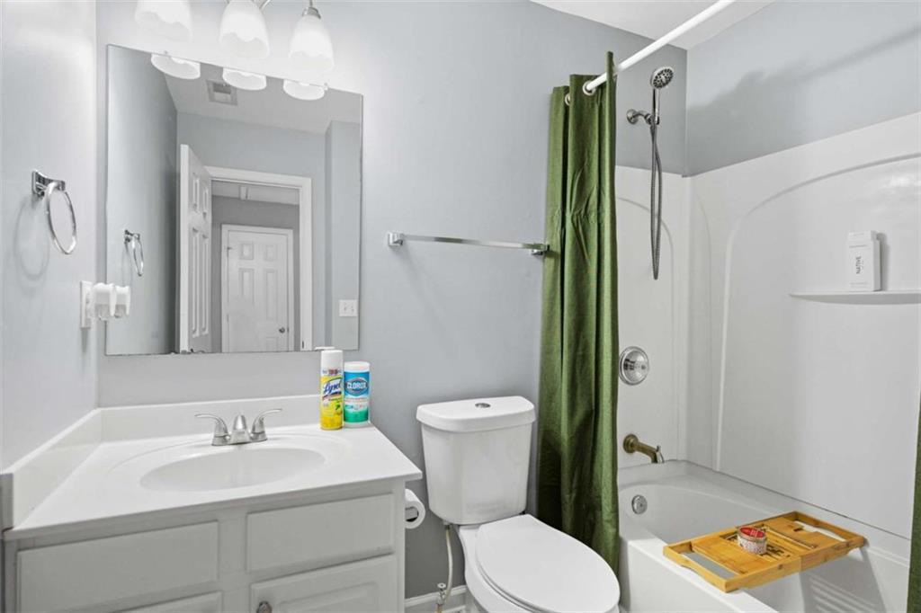 638 Providence Place Southwest Atlanta, GA 30331 - Photo 17 of 22 a bathroom with a sink a toilet and shower