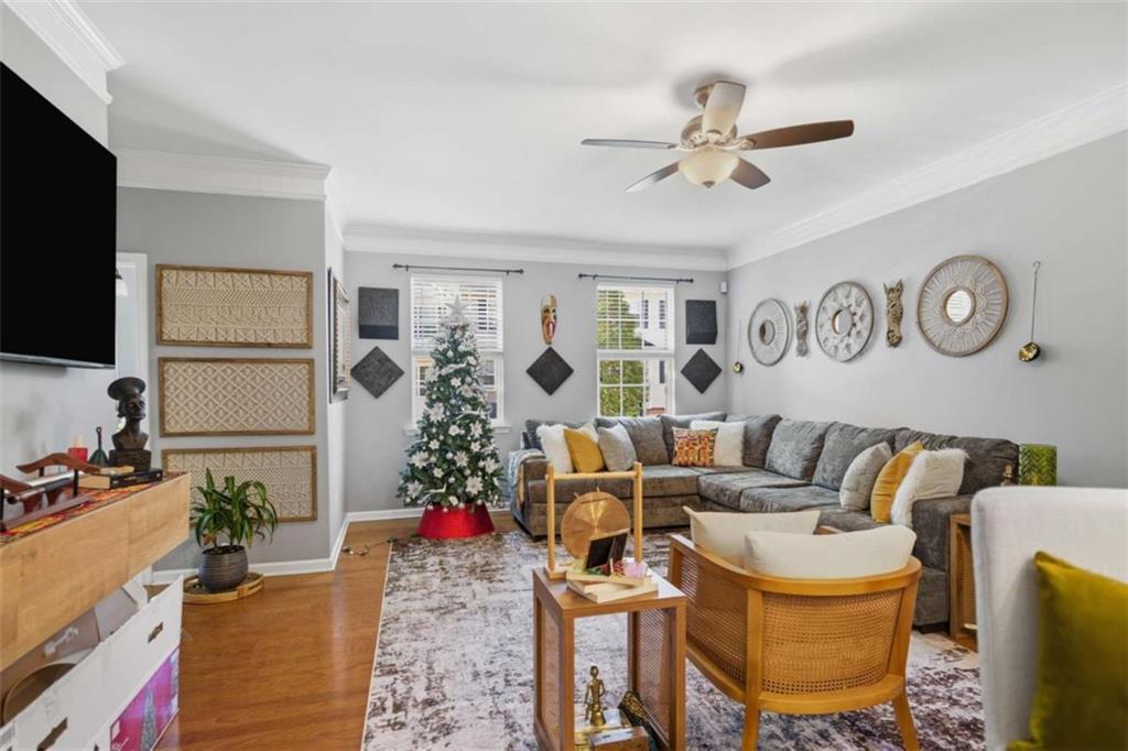 638 Providence Place Southwest Atlanta, GA 30331 - Photo 8 of 22 a living room with a couch and a flat screen tv