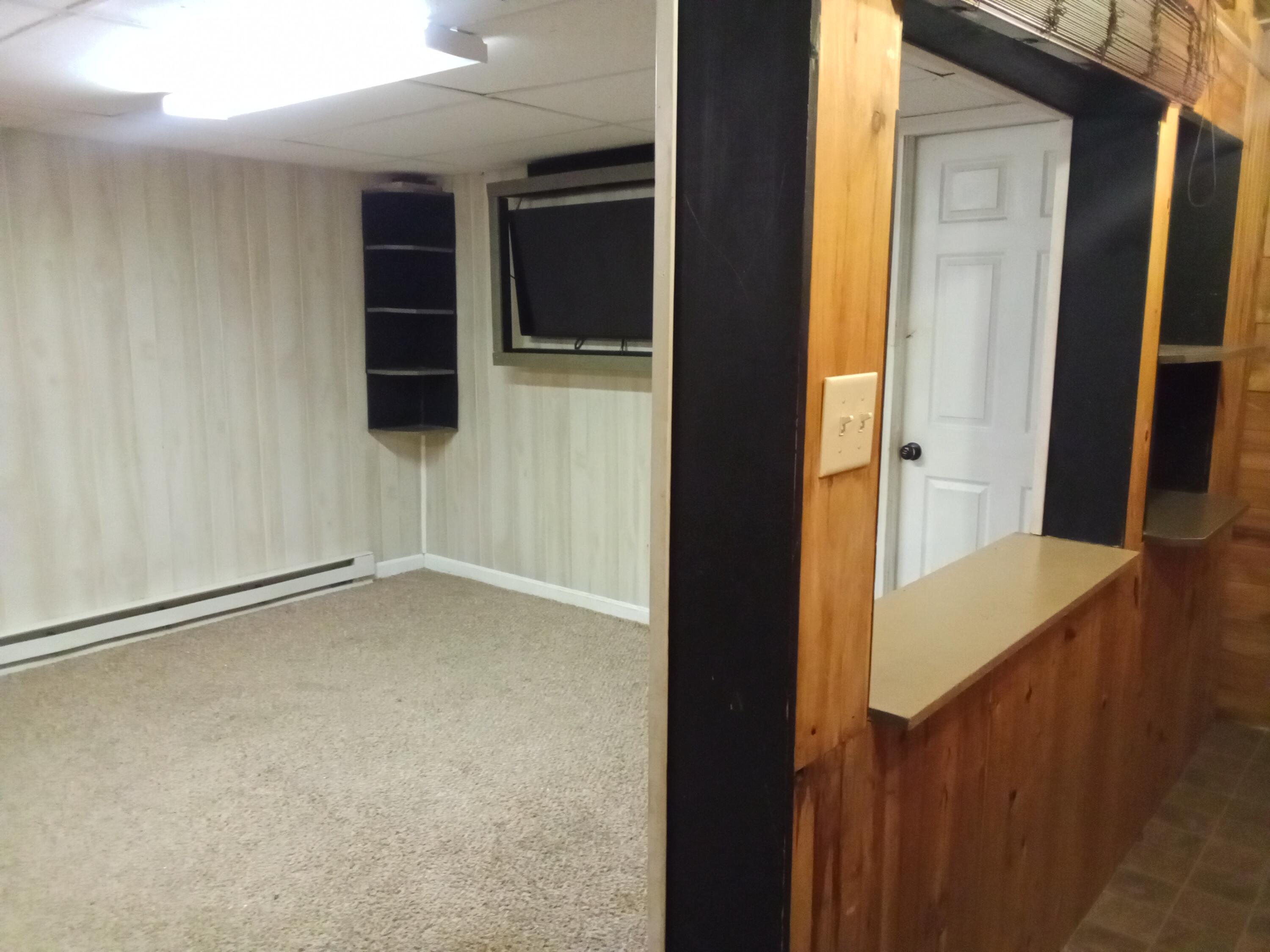 99 Leach Road Ashland, ME 04732 - Photo 18 of 63 17 great room basement with serving area