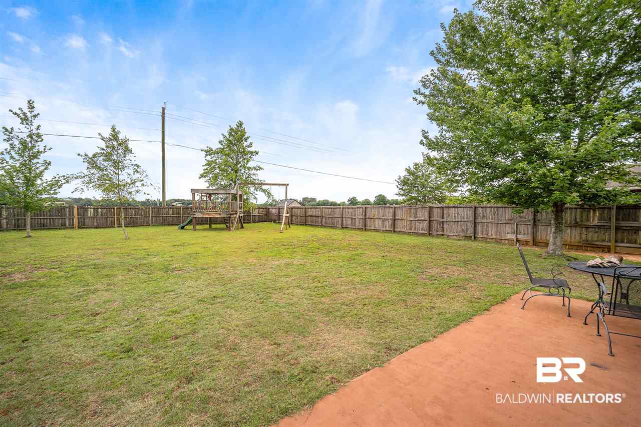 10921 Roanoke Loop Daphne, AL 36526 - Photo 22 of 31 Level Fenced Yard