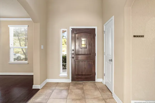 a view of a hallway to rooms