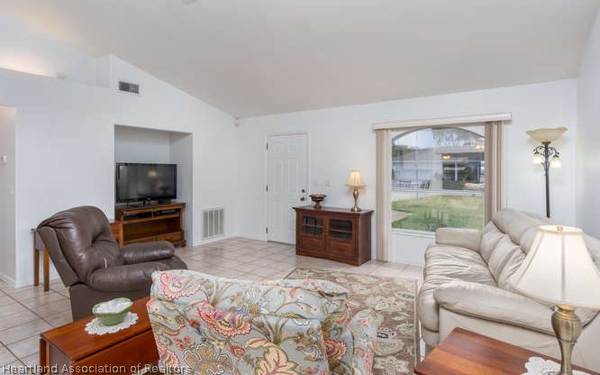 4434 Mandarin Road Sebring, FL 33875 - Photo 3 of 20 a bedroom with furniture and a window