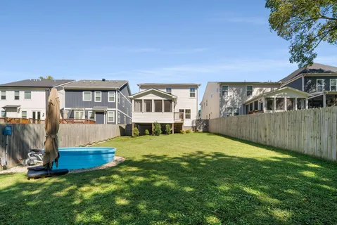 a view of a house with a yard porch and sitting area