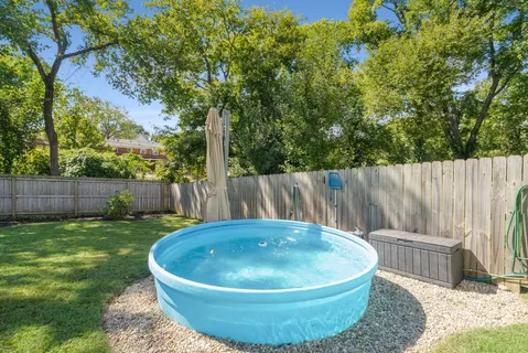an aerial view of multiple houses with yard