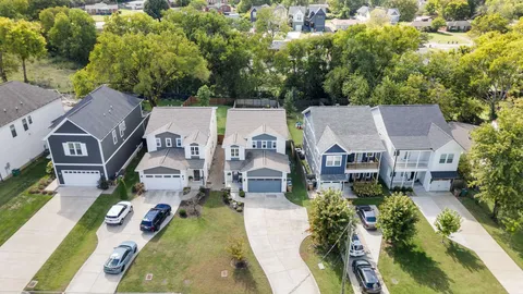 an aerial view of residential house with outdoor space and swimming pool