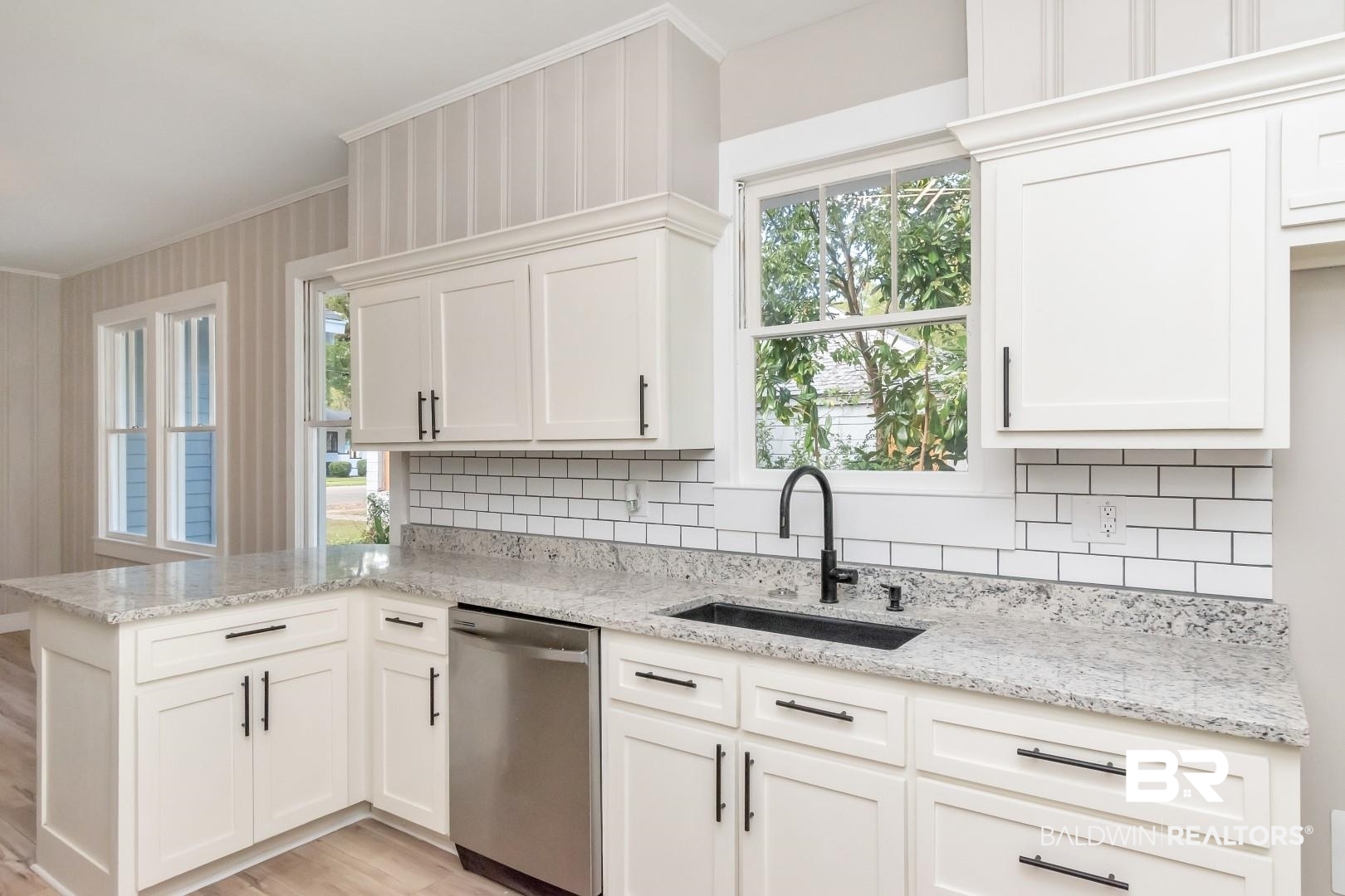555 Michigan Avenue Mobile, AL 36604 - Photo 16 of 28 Kitchen with dishwasher, decorative backsplash, a healthy amount of sunlight, and sink