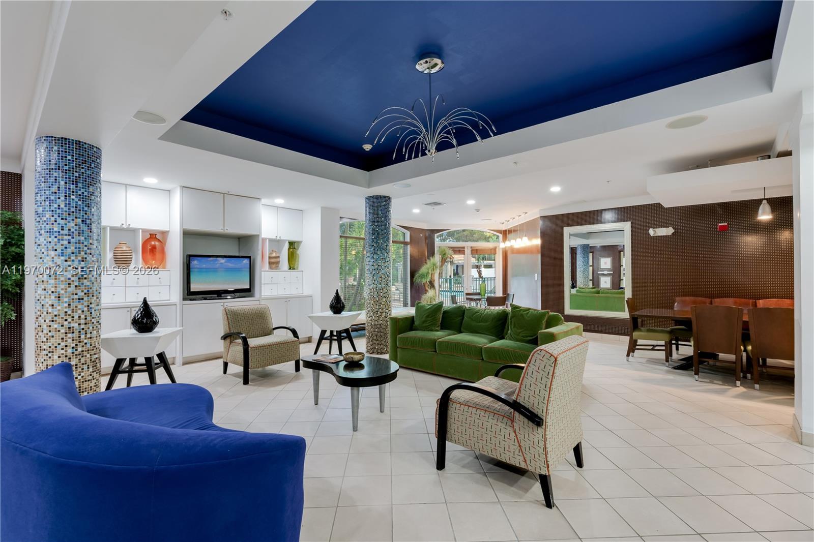 6001 Southwest 70th Street, Unit 221 South Miami, FL 33143 - Photo 7 of 12 a living room with furniture and a large window