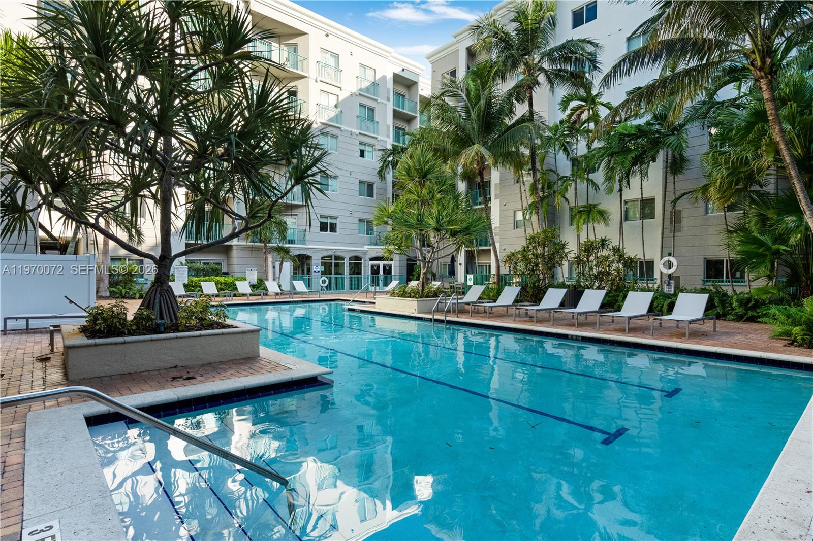 6001 Southwest 70th Street, Unit 221 South Miami, FL 33143 - Photo 10 of 12 a view of a house with pool and sitting area
