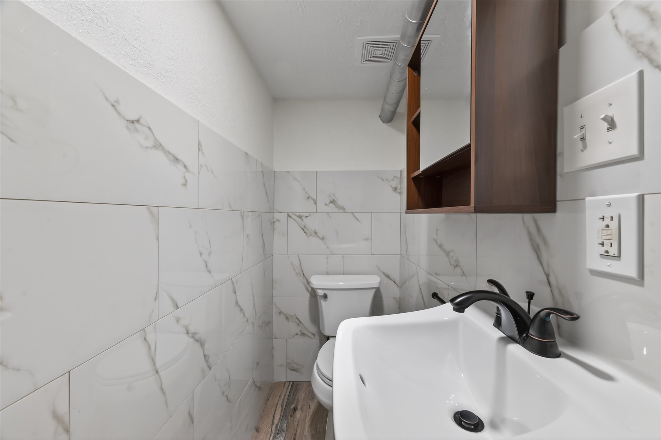2118 Webster Street, Unit 3 Houston, TX 77003 - Photo 25 of 29 a bathroom with a sink a toilet and shower