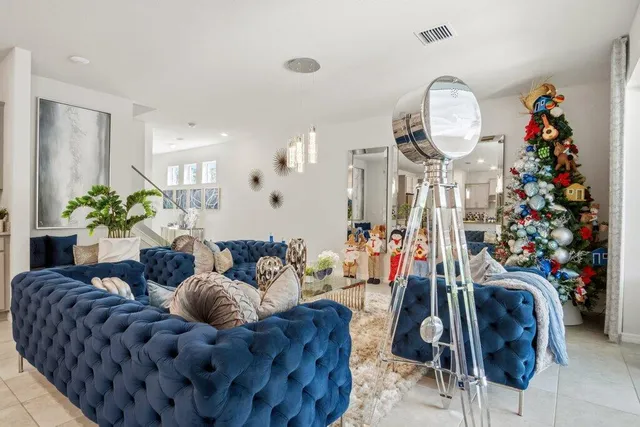 a kitchen with stainless steel appliances granite countertop a sink refrigerator and cabinets