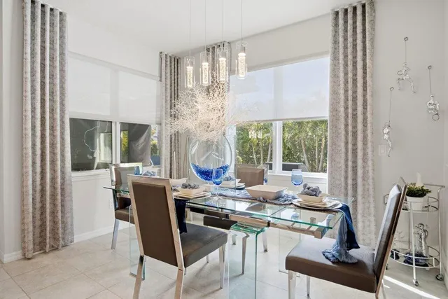 a bedroom with a bed and a mirror on the dresser