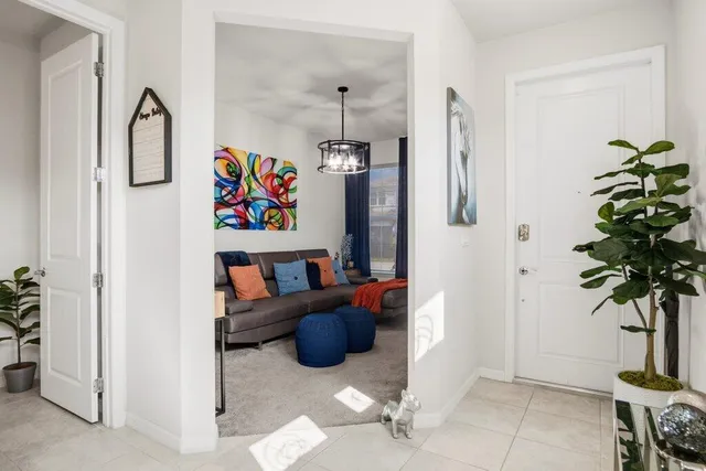 a bedroom with furniture and a window