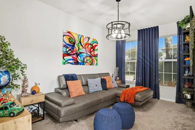 a living room with furniture and a window