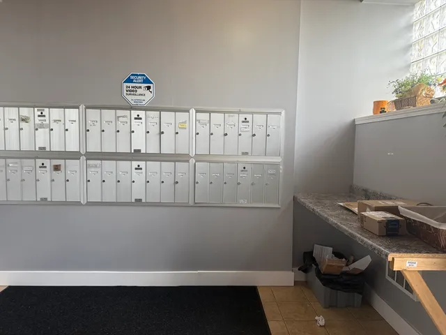 a view of storage and utility room with two washing machine