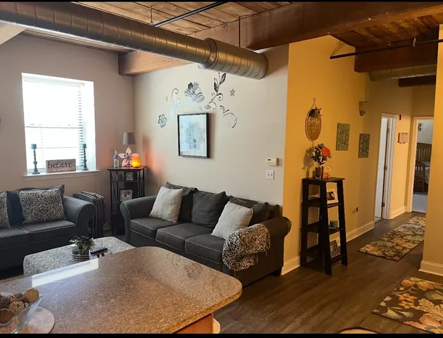 a living room with furniture and a table
