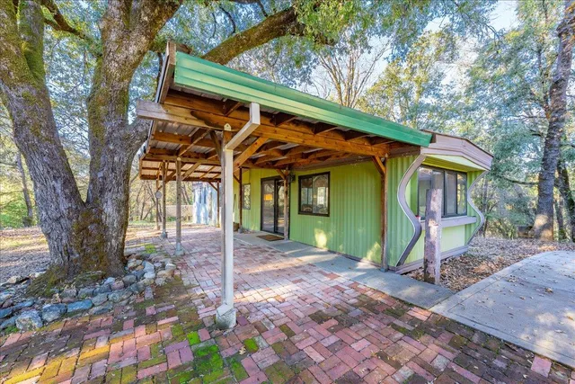 a large kitchen with a large window and stainless steel appliances