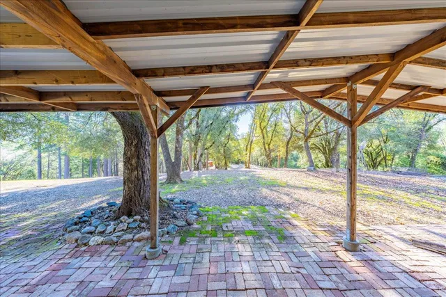 a dining room with furniture and a floor to ceiling window