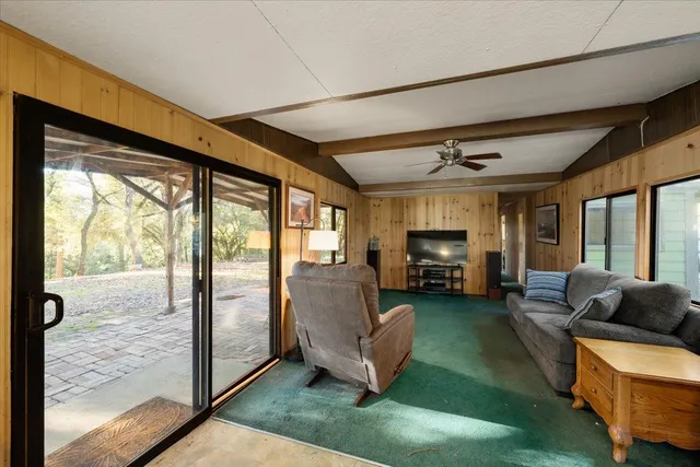 a bedroom with a large bed and a large window