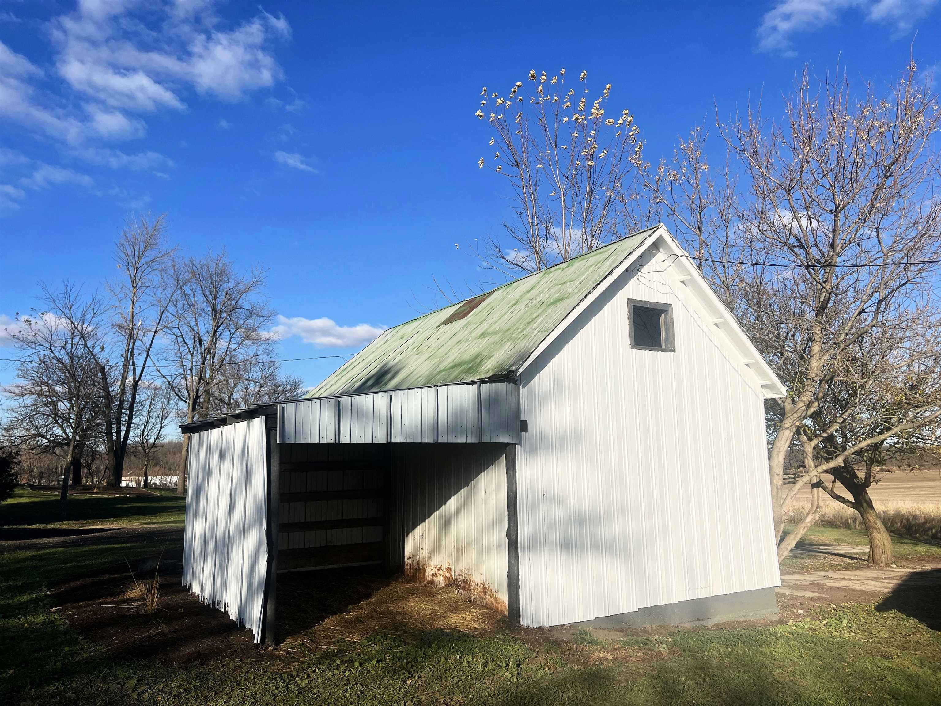7918 Shirley Road Cherry Valley, IL 61016 - Photo 22 of 36 a view of a house with a yard