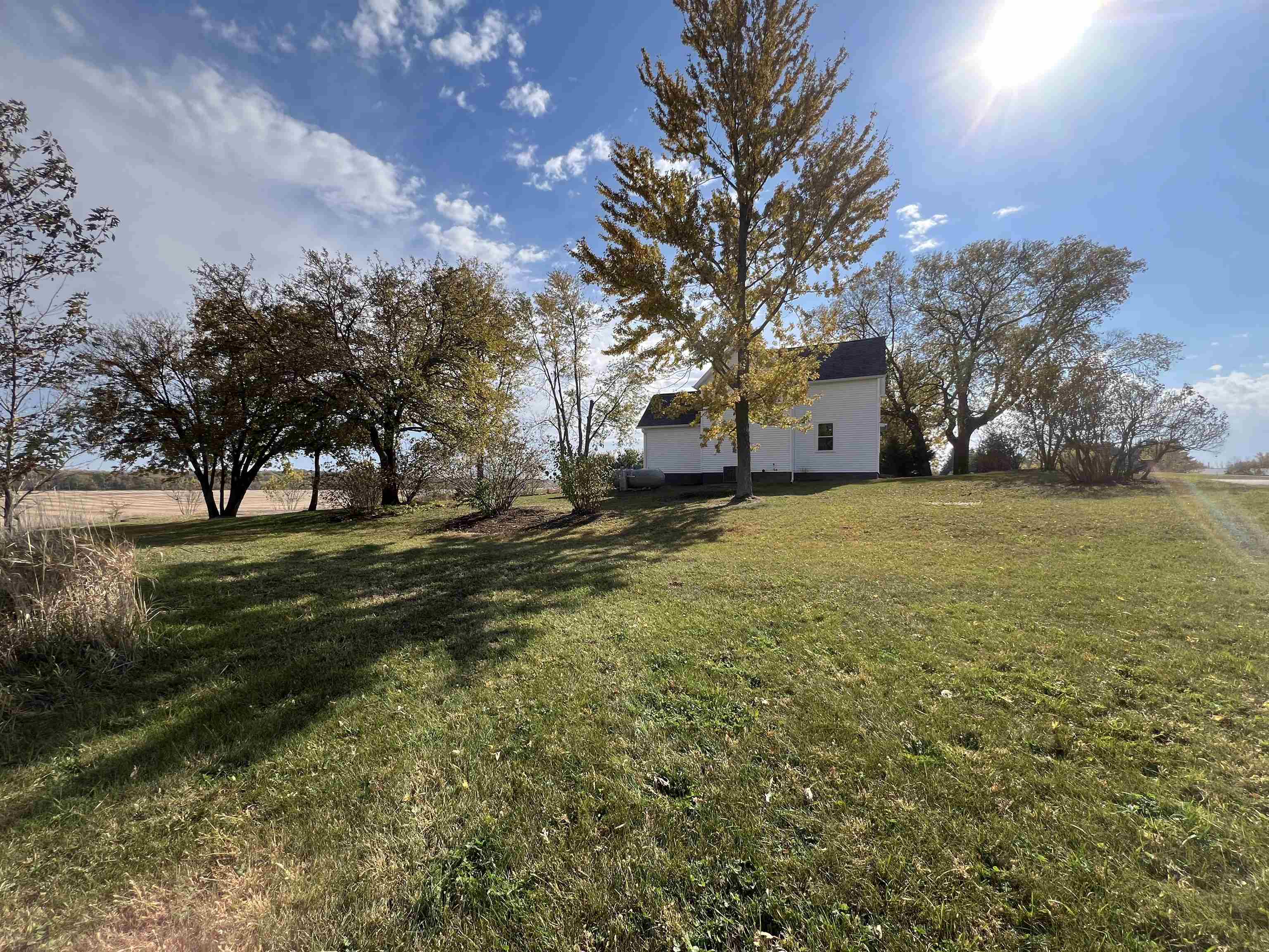 7918 Shirley Road Cherry Valley, IL 61016 - Photo 25 of 36 a view of a yard with a house in the background