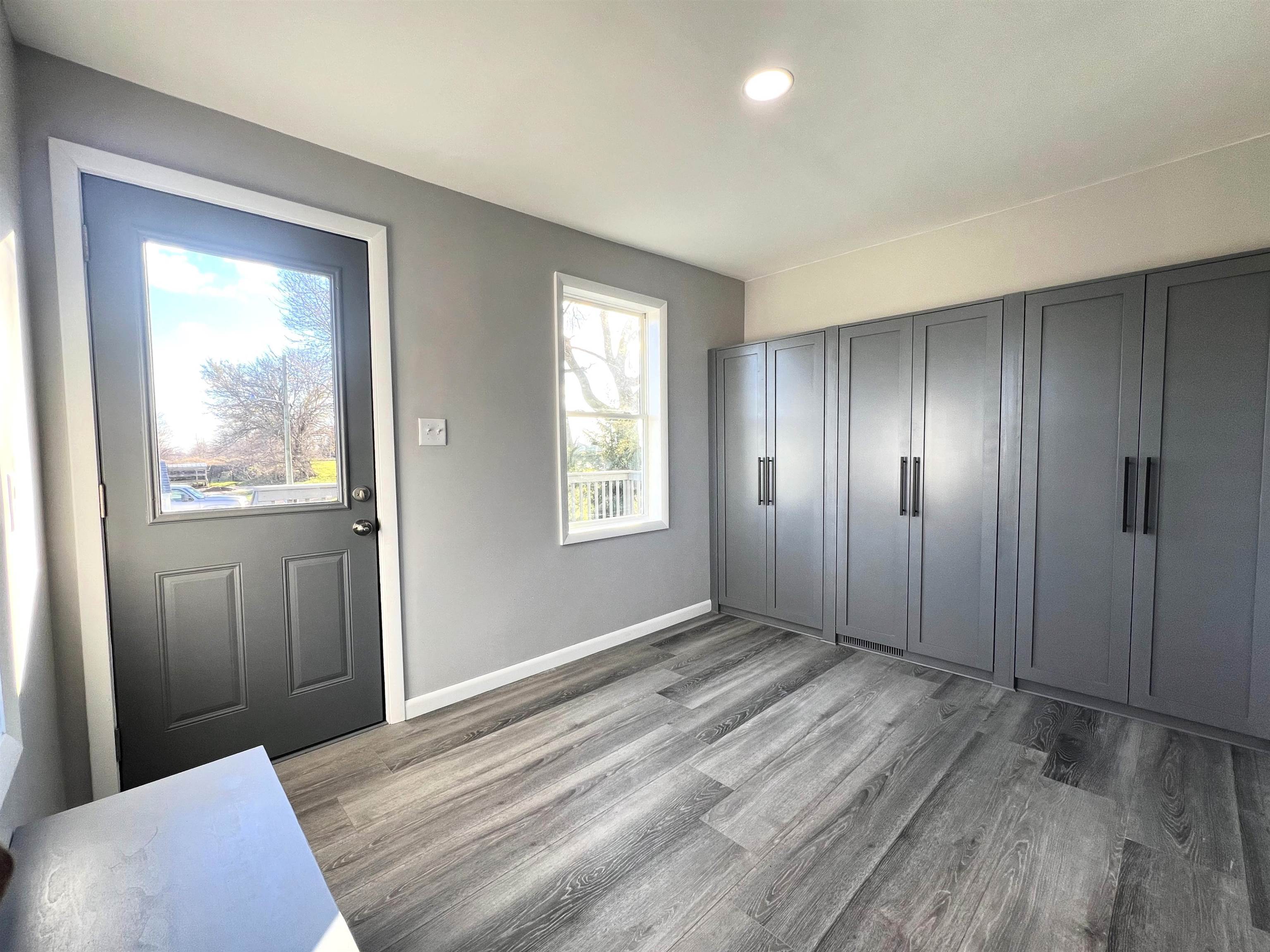 7918 Shirley Road Cherry Valley, IL 61016 - Photo 4 of 36 a view of an empty room with wooden floor and a window