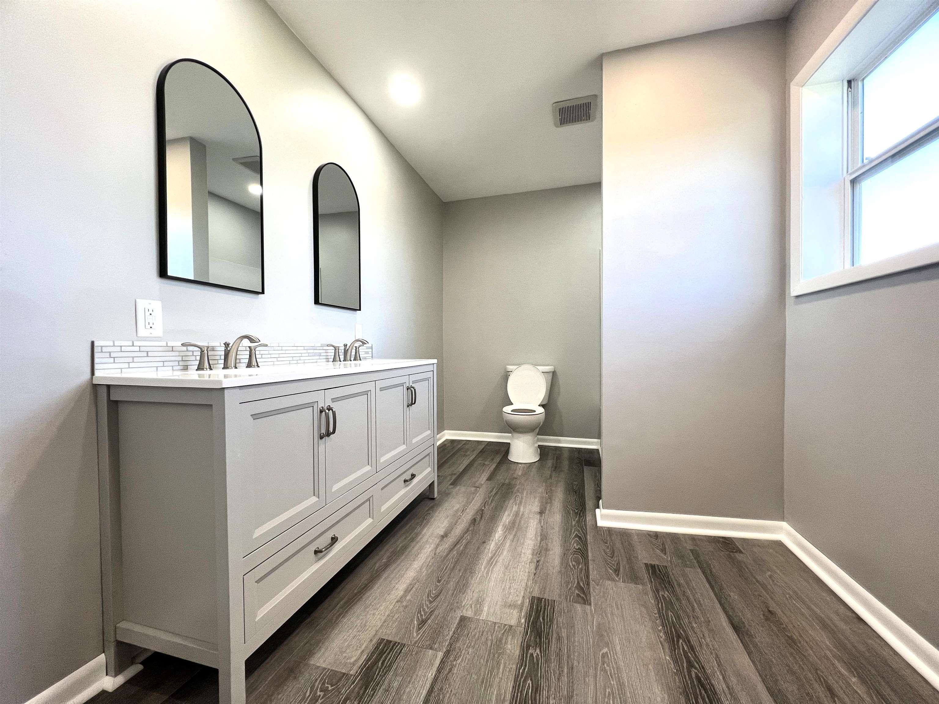 7918 Shirley Road Cherry Valley, IL 61016 - Photo 8 of 36 a spacious bathroom with a double vanity sink and a mirror