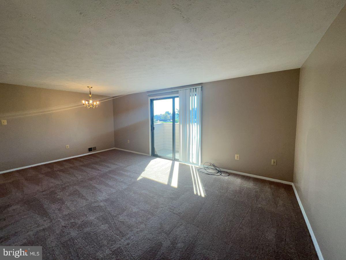 700 H Heather Ridge Drive, Unit 13H Frederick, MD 21702 - Photo 2 of 12 an empty room with windows