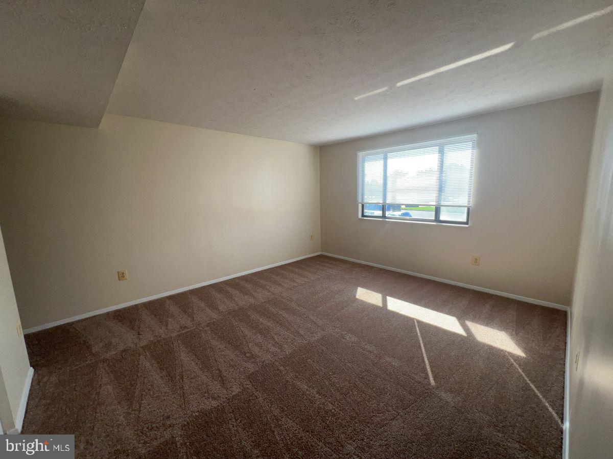 700 H Heather Ridge Drive, Unit 13H Frederick, MD 21702 - Photo 7 of 12 an empty room with windows