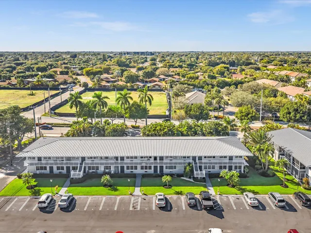 a view of a swimming pool with a yard