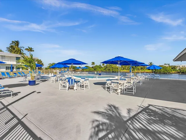 a view of a swimming pool and a yard
