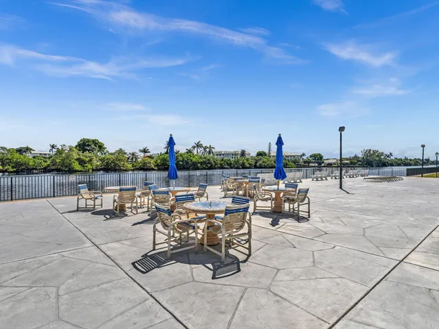 a view of roof deck with outdoor seating and city view