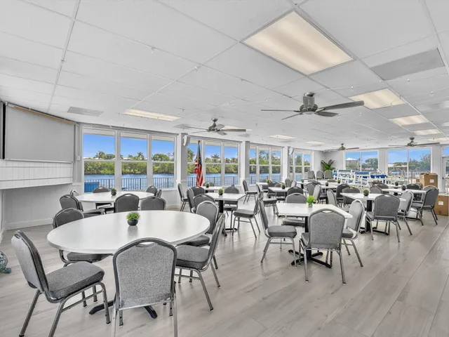 a kitchen with stainless steel appliances a refrigerator sink and cabinets