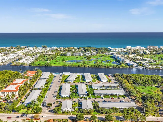 a view of swimming pool with outdoor seating and yard in back