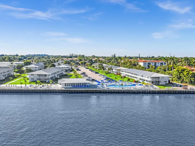 a view of a swimming pool with an outdoor seating and deck