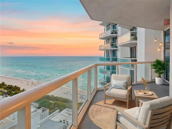 a balcony with an outdoor seating