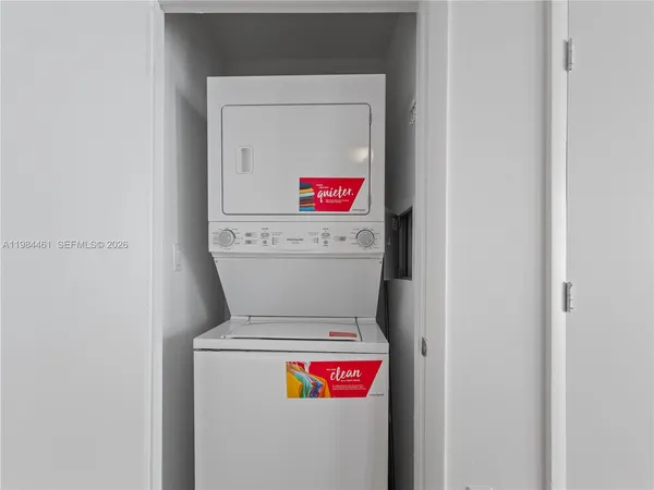 a utility room with dryer and washer