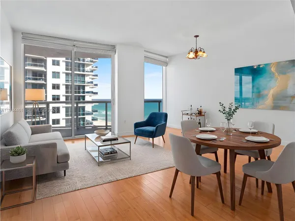 a living room with furniture and a large window