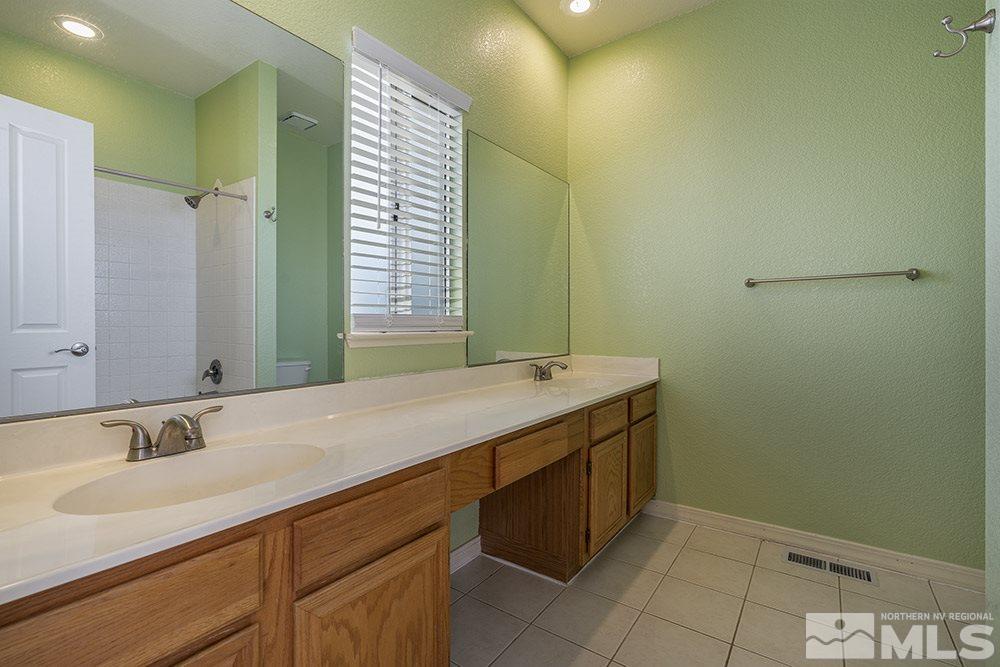 3943 Regal Drive Reno, NV 89503 - Photo 19 of 29 a bathroom with a sink and a mirror