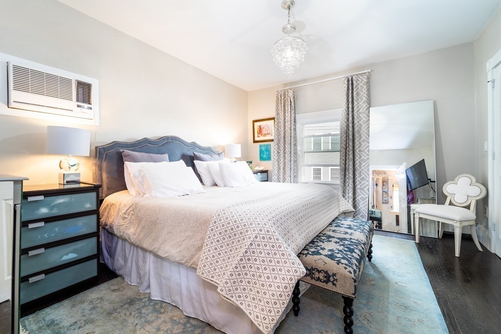 32 Covington Street, Unit SF Boston, MA 02127 - Photo 12 of 27 a bedroom with a bed and wooden floor