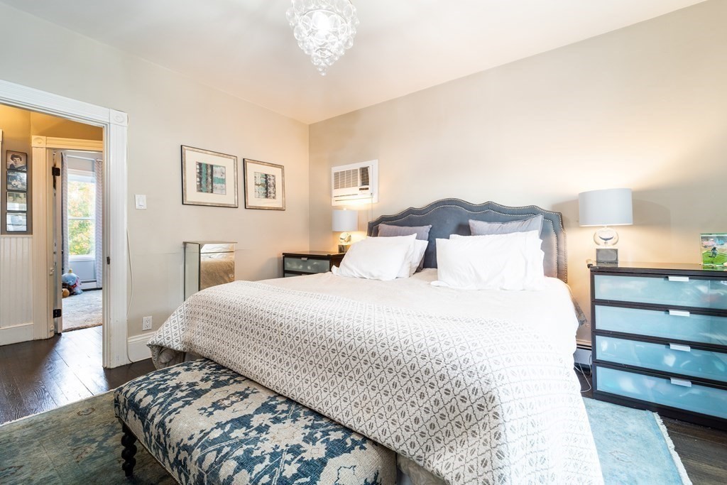 32 Covington Street, Unit SF Boston, MA 02127 - Photo 14 of 27 a bedroom with a bed and wooden floor