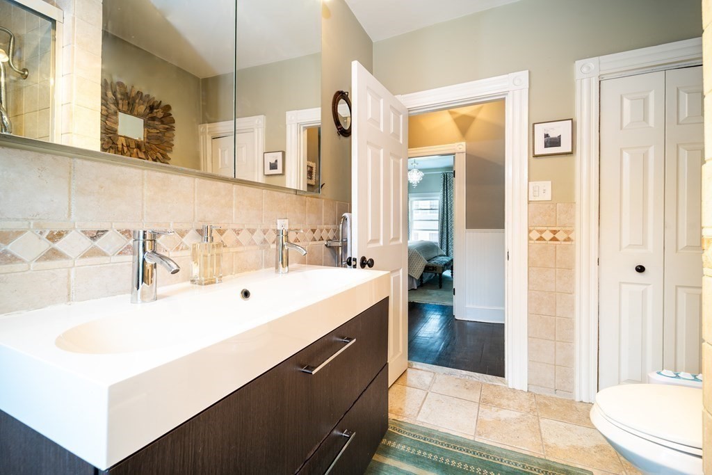 32 Covington Street, Unit SF Boston, MA 02127 - Photo 16 of 27 a en suite bathroom with a sink and a mirror