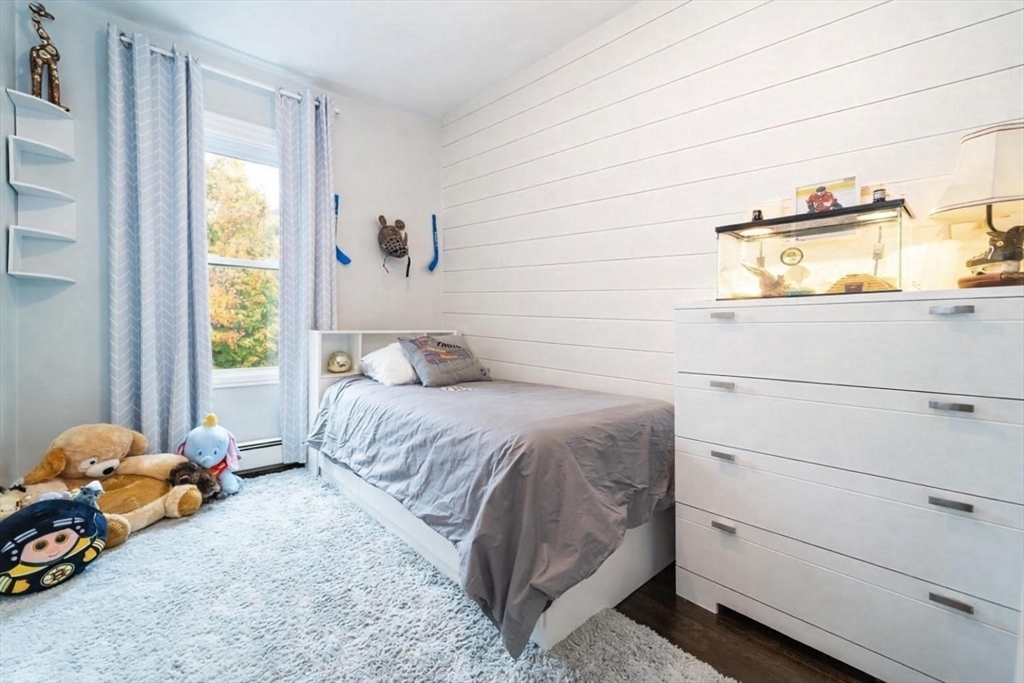 32 Covington Street, Unit SF Boston, MA 02127 - Photo 17 of 27 a bedroom with a bed and a window