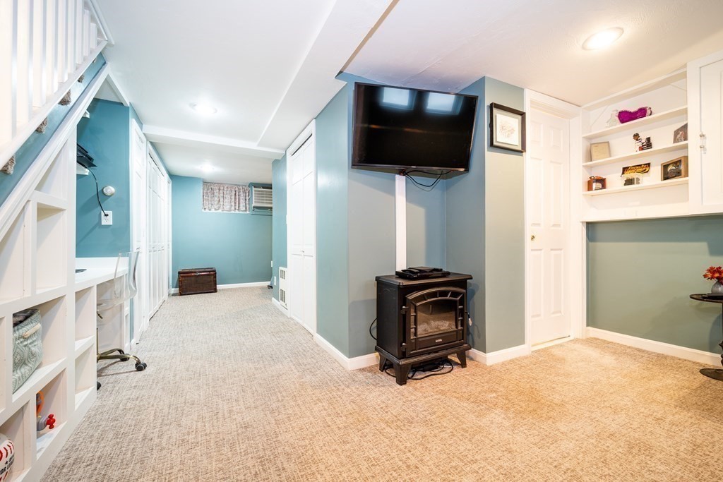 32 Covington Street, Unit SF Boston, MA 02127 - Photo 21 of 27 a view of a livingroom with workspace and a flat screen tv