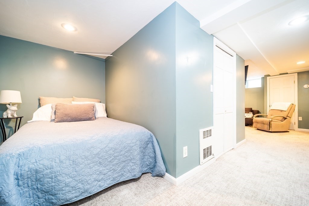 32 Covington Street, Unit SF Boston, MA 02127 - Photo 22 of 27 a bedroom with a bed and a view of bathroom