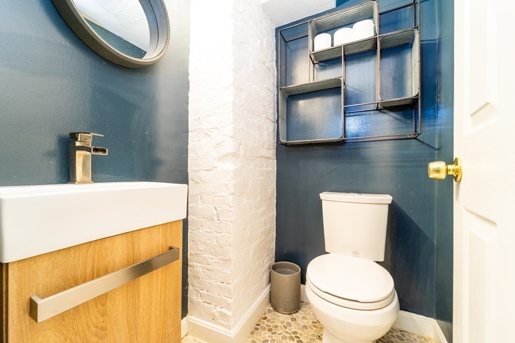 32 Covington Street, Unit SF Boston, MA 02127 - Photo 23 of 27 a bathroom with a toilet and a mirror