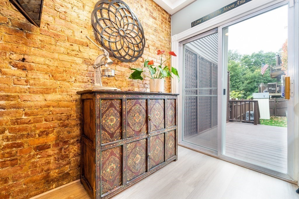 32 Covington Street, Unit SF Boston, MA 02127 - Photo 9 of 27 a view of entrance gate with wooden fence