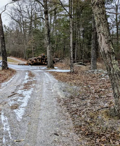 a view of street with parked cars